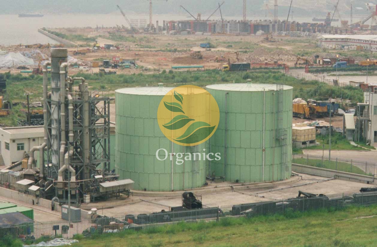 Aerial view of large leachate treatment tanks and processing plant at a landfill site