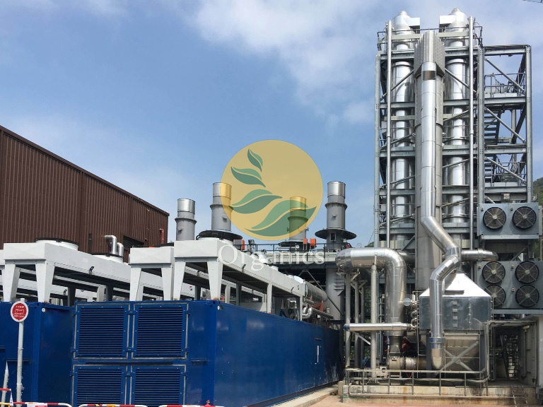 Anaerobic digester tanks and biogas processing skid at an industrial dairy site