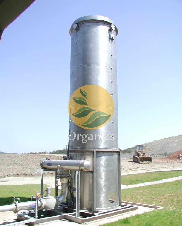 Close-up of galvanised pipework and stainless steel burner components on a flare stack