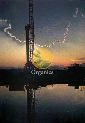 Drilling rig silhouetted against a dusk sky at a coal bed methane extraction site