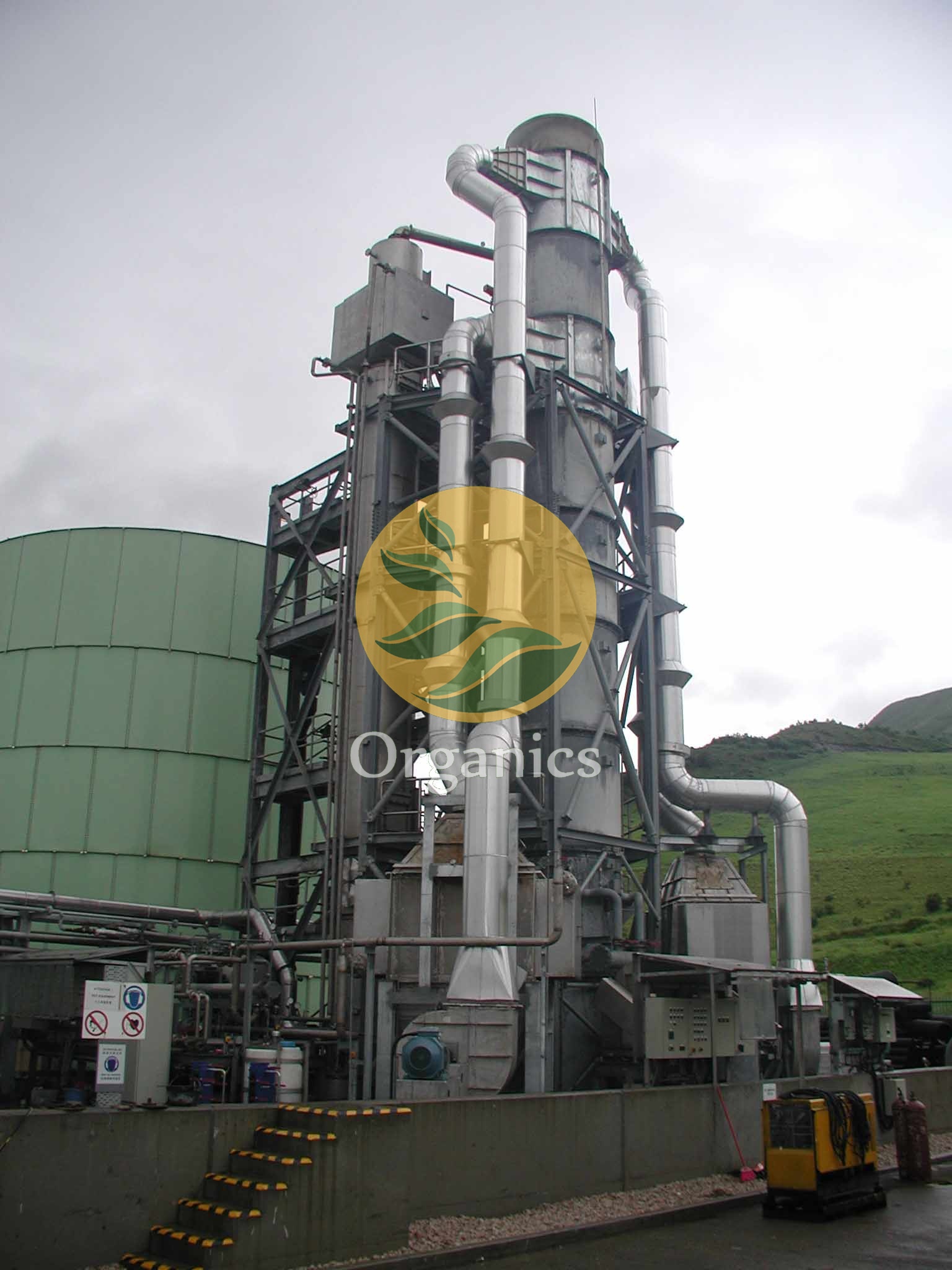 Exterior view of a tall ammonia stripping column installed at a landfill site