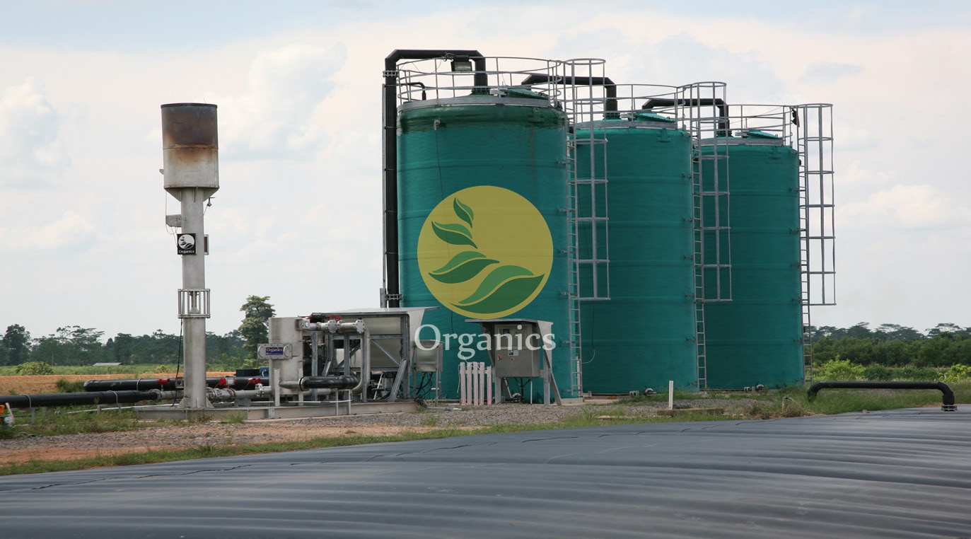 Green anaerobic digester tanks at a cassava mill wastewater treatment site