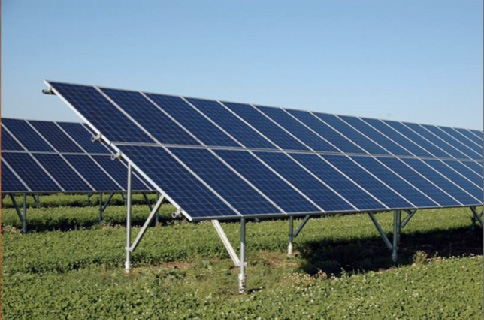 Rows of solar PV panels in a typical solar park array under a clear sky