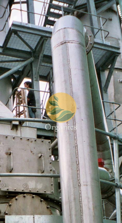 Waste feedstock being loaded into a pyrolysis processing line for energy recovery